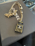 Chanel Black Resin Perfume Bottle Necklace Goldtone Faux Pearl